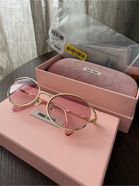 Miu Miu Gold Frame Sunglasses with Pink Lenses
